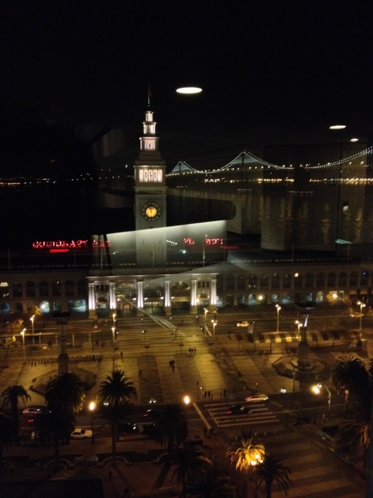 Space ships landing on Ferry Building or reflection form window of Hyatt Embarcadero