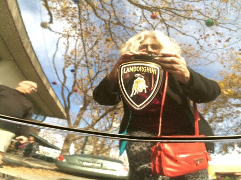 Selfie of me photographing the Lambo insignia