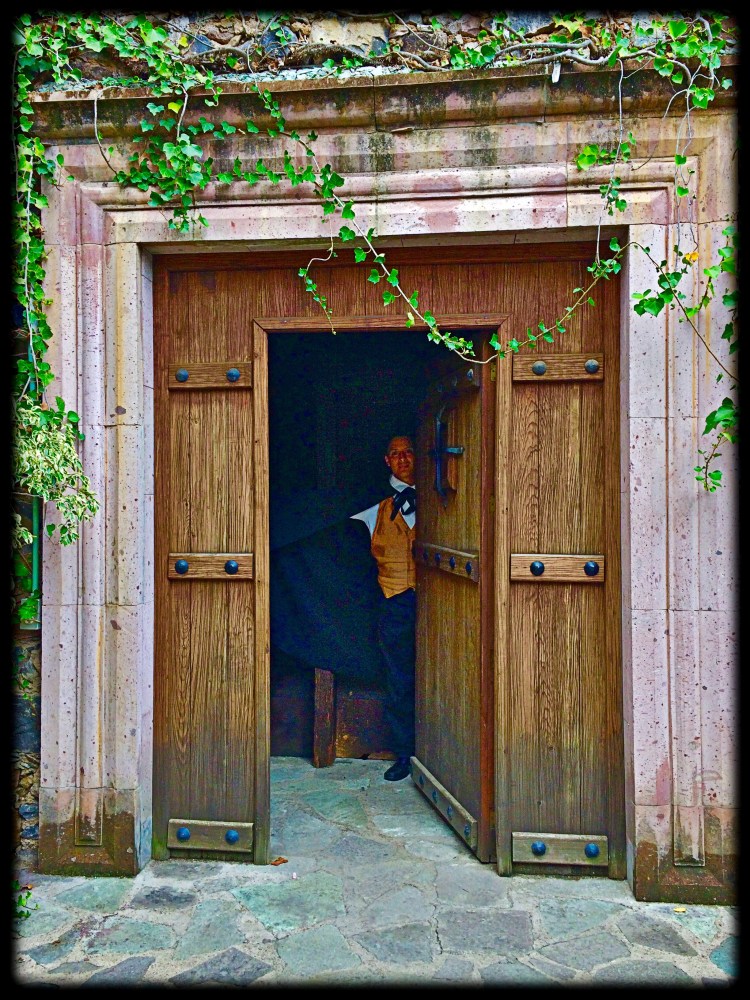 Open door to Caped man