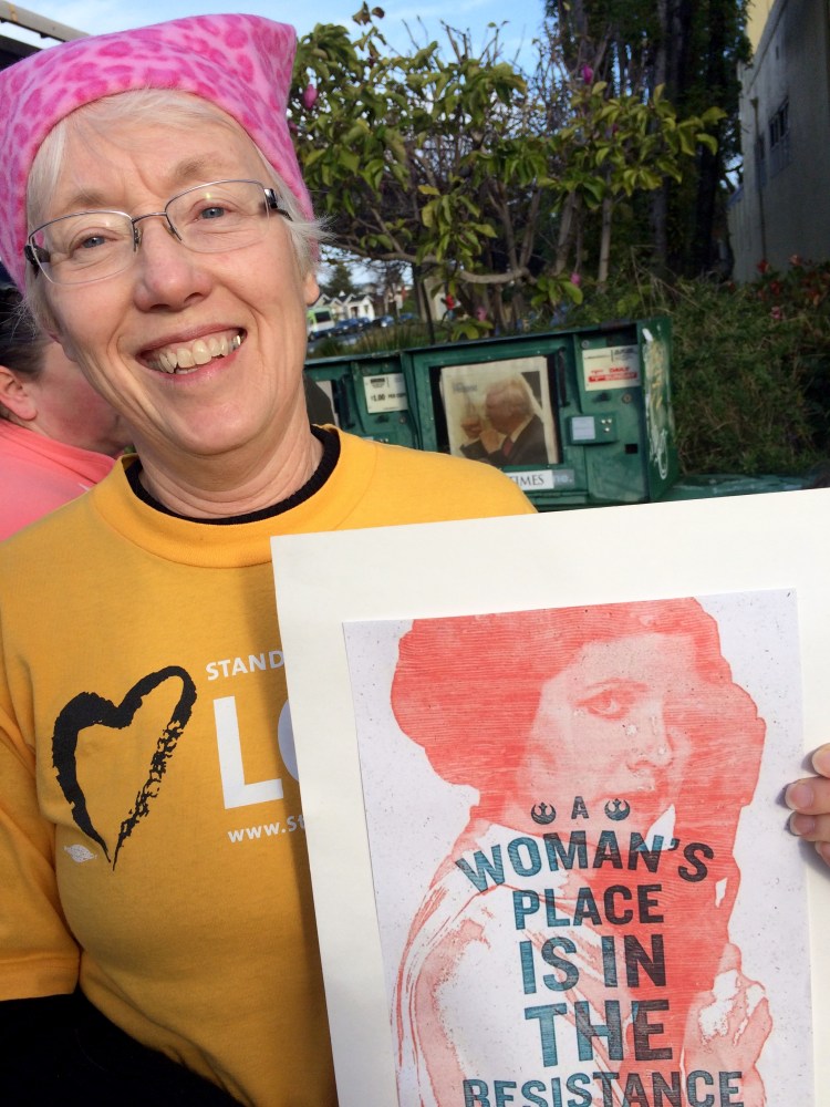 My friend Ann wearing a hat I made and caring a sign I made